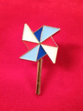 Pinwheel metal and enamel pin